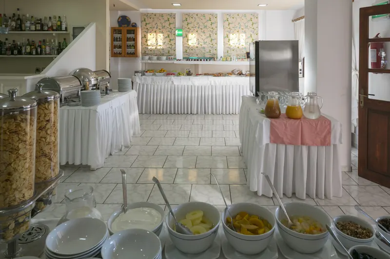 The breakfast buffet with cereals, fruit and pastries