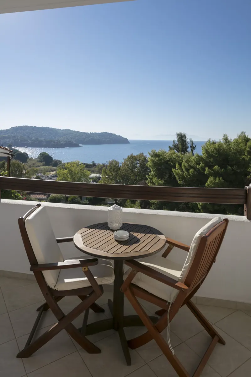 Sea view from a balcony with two chairs