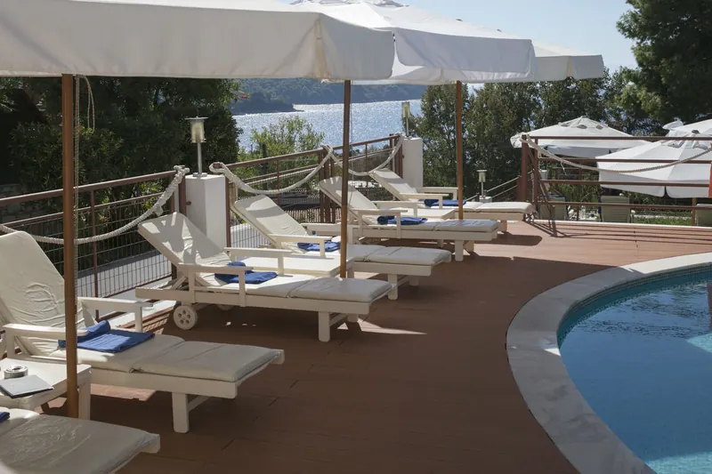 Sun loungers and parasols beside the pool